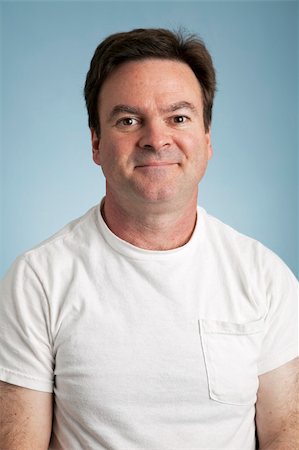 Portrait of an average man in a blank white t-shirt. Stock Photo - Budget Royalty-Free & Subscription, Code: 400-04199819