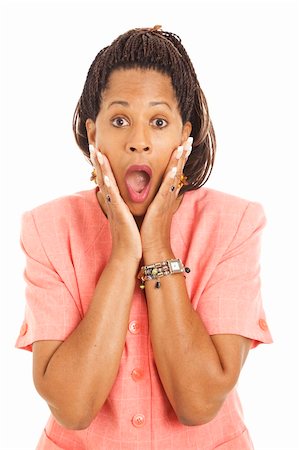 Beautiful African-American businesswoman is shocked.  Isolated on white. Stock Photo - Budget Royalty-Free & Subscription, Code: 400-04199823