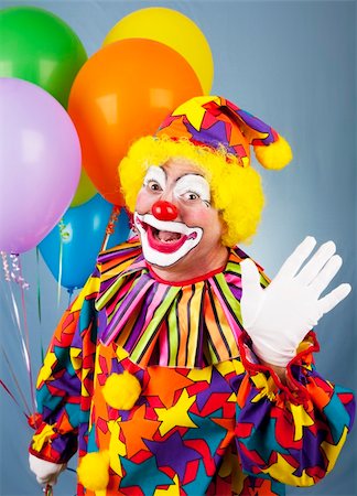 simsearch:400-04408991,k - Friendly circus clown holding a bunch of balloons and waving hello. Foto de stock - Super Valor sin royalties y Suscripción, Código: 400-04199865