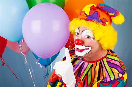 simsearch:400-04408991,k - Colorful circus clown making the shhh gesture. Foto de stock - Super Valor sin royalties y Suscripción, Código: 400-04199868