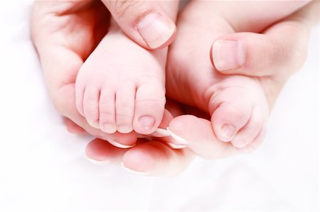simsearch:400-04235194,k - Detail of newborn's feet in mother's hands - shallow DOF Stock Photo - Budget Royalty-Free & Subscription, Code: 400-04199924