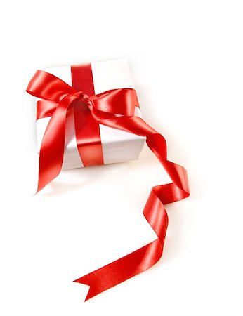 simsearch:400-05747950,k - Gift box wrapped with red satin ribbon on white Foto de stock - Super Valor sin royalties y Suscripción, Código: 400-04199931