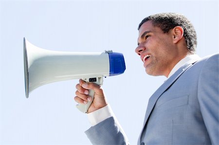 simsearch:400-04126489,k - Charismatic businessman yelling through a megaphone outdoor Stock Photo - Budget Royalty-Free & Subscription, Code: 400-04190026