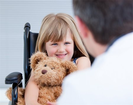 simsearch:400-05147195,k - Smiling little girl sitting on the wheelchair with her teddy bear at the hospital Stock Photo - Budget Royalty-Free & Subscription, Code: 400-04190188