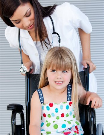 simsearch:400-05147195,k - Smiling cute girl sitting on the wheelchair at the hospital Stock Photo - Budget Royalty-Free & Subscription, Code: 400-04190194