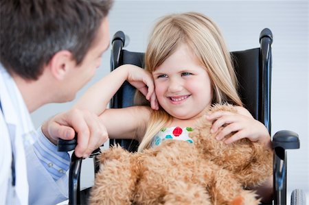 simsearch:400-05147195,k - Laughing little girl sitting on the wheelchair at the hospital Stock Photo - Budget Royalty-Free & Subscription, Code: 400-04190192