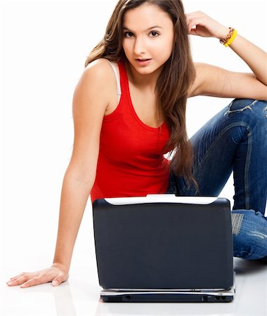 Beautiful young female student with a laptop, isolated on white Stock Photo - Budget Royalty-Free & Subscription, Code: 400-04190446