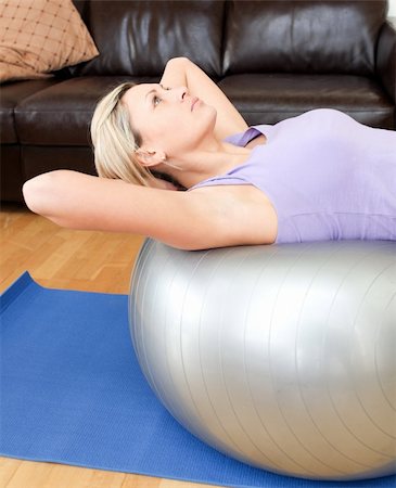 Relaxed woman doing exercice at home Stock Photo - Budget Royalty-Free & Subscription, Code: 400-04190769