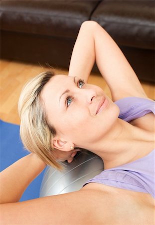 Portrait of a beautiful woman doing exercice at home Stock Photo - Budget Royalty-Free & Subscription, Code: 400-04190775