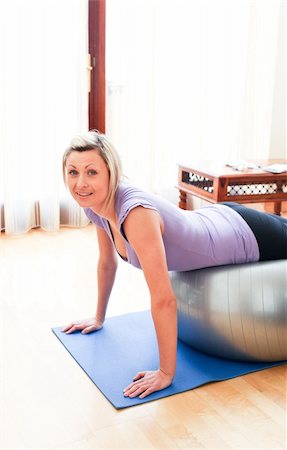Caucasian woman doing exercice at home Stock Photo - Budget Royalty-Free & Subscription, Code: 400-04190776