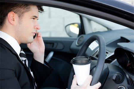 Attractive businessman talking on the phone in a car Stock Photo - Budget Royalty-Free & Subscription, Code: 400-04190895