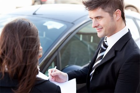 Pretty businessman meeting his colleague in the street Stock Photo - Budget Royalty-Free & Subscription, Code: 400-04190901