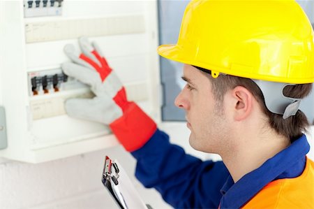 Caucasian electrician repairing a power plan at work Stock Photo - Budget Royalty-Free & Subscription, Code: 400-04190935