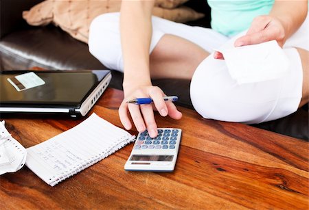 Beautiful woman doing accountancy at home Stock Photo - Budget Royalty-Free & Subscription, Code: 400-04190982