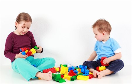 Adorable kids playing together with blocks Stock Photo - Budget Royalty-Free & Subscription, Code: 400-04191625