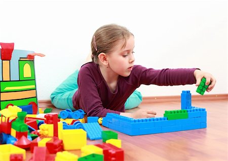 Adorable girl playing with blocks Stock Photo - Budget Royalty-Free & Subscription, Code: 400-04191627