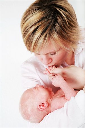 Mother trying to rest her baby Stock Photo - Budget Royalty-Free & Subscription, Code: 400-04191637