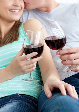 Close-up of a young couple drinking red wine at home Stock Photo - Budget Royalty-Free & Subscription, Code: 400-04191738