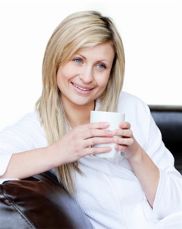 simsearch:6109-06194821,k - Lively woman holding a cup of coffee against a white background Foto de stock - Super Valor sin royalties y Suscripción, Código: 400-04191789