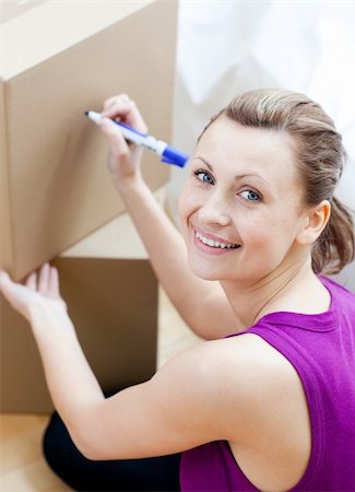 simsearch:400-04663577,k - Attractive woman closing a box at home Stock Photo - Budget Royalty-Free & Subscription, Code: 400-04191846