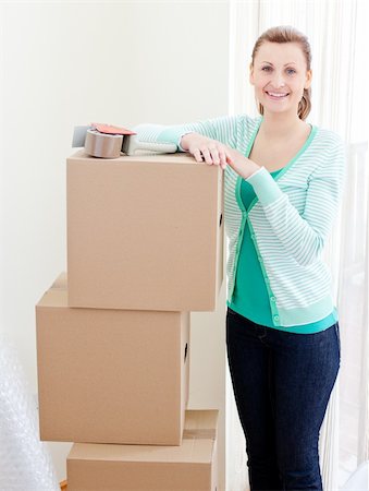 simsearch:400-04663577,k - Beautiful woman closing various boxes at home Stock Photo - Budget Royalty-Free & Subscription, Code: 400-04191847