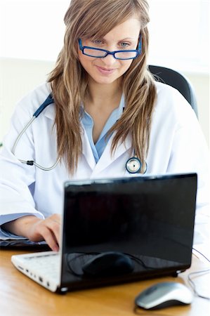 doctor business computer - Young attractive Female doctor working on a laptop Stock Photo - Budget Royalty-Free & Subscription, Code: 400-04191877