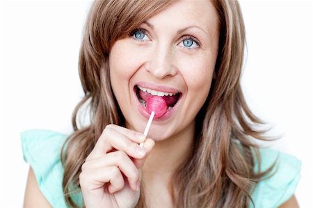 Radiant woman holding a lollipop against a white background Stock Photo - Budget Royalty-Free & Subscription, Code: 400-04191966