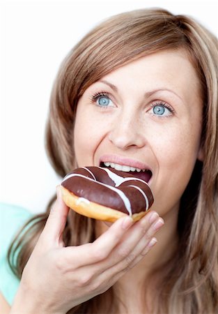 simsearch:400-04212407,k - Caucasian woman eating a cake against a white background Stock Photo - Budget Royalty-Free & Subscription, Code: 400-04191969