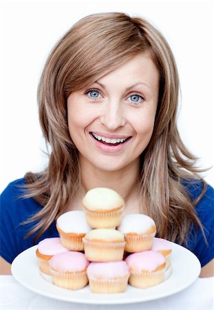 simsearch:400-04212407,k - Confident woman eating a cake against a white background Stock Photo - Budget Royalty-Free & Subscription, Code: 400-04191976