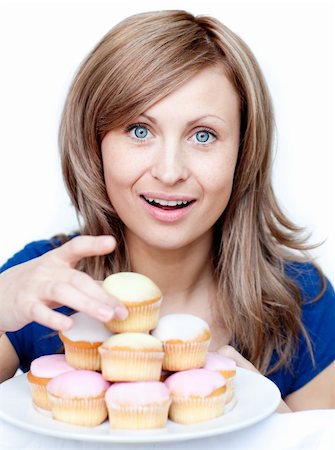 simsearch:400-04729451,k - Bright woman holding a plate of cakes at home Stock Photo - Budget Royalty-Free & Subscription, Code: 400-04191977