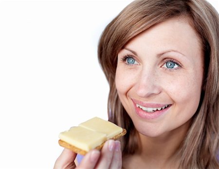 simsearch:400-04212407,k - Cheerful woman eating a cracker with cheese isolated on a white background Stock Photo - Budget Royalty-Free & Subscription, Code: 400-04191999