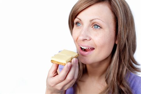 simsearch:400-04212407,k - Attractive woman eating a cracker with cheese isolated on a white background Stock Photo - Budget Royalty-Free & Subscription, Code: 400-04192001