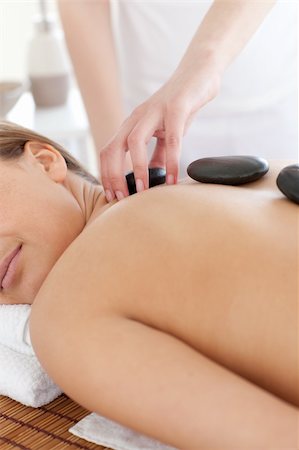 simsearch:400-04192063,k - Delighted woman relaxing on a massage table against a white background Fotografie stock - Microstock e Abbonamento, Codice: 400-04192085