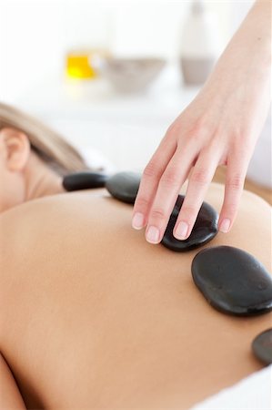 simsearch:400-04192063,k - Close-up of a caucasian woman relaxing on a massage table against a white background Fotografie stock - Microstock e Abbonamento, Codice: 400-04192089