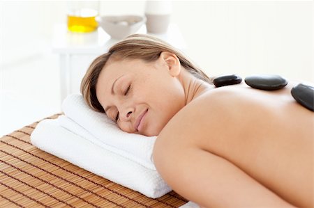 simsearch:400-04192063,k - Beautiful woman relaxing on a massage table against a white background Fotografie stock - Microstock e Abbonamento, Codice: 400-04192082