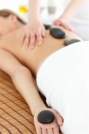 simsearch:400-04192103,k - Close-up of a bright woman relaxing on a massage table against a white background Stock Photo - Budget Royalty-Free & Subscription, Code: 400-04192090