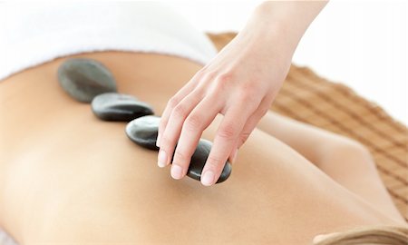simsearch:400-04192063,k - Close-up of a caucasian woman lying on a massage table against a white background Fotografie stock - Microstock e Abbonamento, Codice: 400-04192108