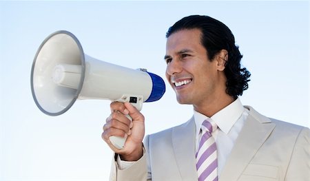 simsearch:400-04126489,k - Portrait of a latin business man shouting through a megaphone against a blue sky background Stock Photo - Budget Royalty-Free & Subscription, Code: 400-04192242