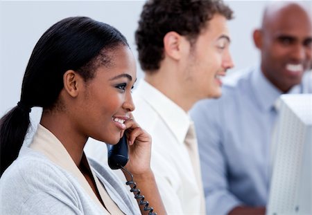 simsearch:673-02137713,k - Positive Afro-American businesswoman talking on phone in the office Stock Photo - Budget Royalty-Free & Subscription, Code: 400-04192267