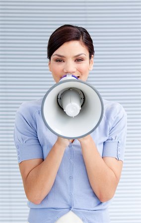 simsearch:622-02354257,k - Positive businesswoman yelling through a megaphone at work Stock Photo - Budget Royalty-Free & Subscription, Code: 400-04192291