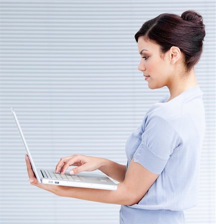 simsearch:400-04187842,k - Confident businesswoman using a laptop at work Stock Photo - Budget Royalty-Free & Subscription, Code: 400-04192316