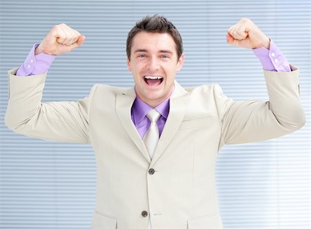 person punching for victory - Jolly businessman puniching the air in celebration Stock Photo - Budget Royalty-Free & Subscription, Code: 400-04192313
