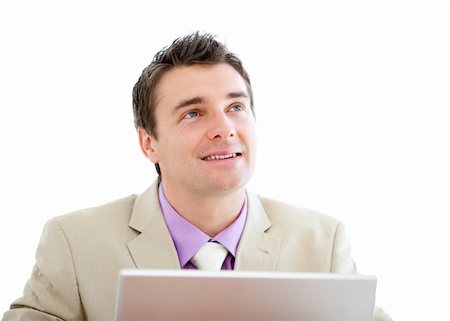 simsearch:400-05285550,k - Pensive businessman using a laptop against a white background Stockbilder - Microstock & Abonnement, Bildnummer: 400-04192322