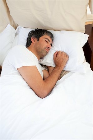 simsearch:400-05739935,k - Doleful man sleeping after having an argument Stock Photo - Budget Royalty-Free & Subscription, Code: 400-04192553