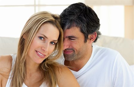simsearch:400-04326193,k - Portrait of a loving couple sitting on bed at home Stock Photo - Budget Royalty-Free & Subscription, Code: 400-04193018