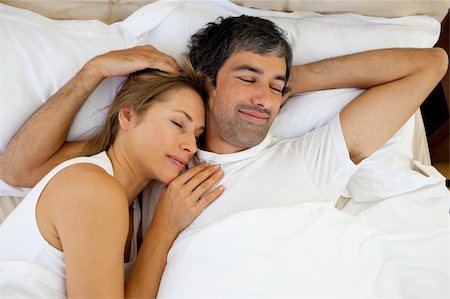 romantic pictures of lovers sleeping - Positive couple sleeping lying in bed Stock Photo - Budget Royalty-Free & Subscription, Code: 400-04193044