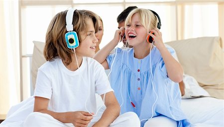 simsearch:400-04200290,k - Joyful children having fun and listening music at home Stock Photo - Budget Royalty-Free & Subscription, Code: 400-04193124