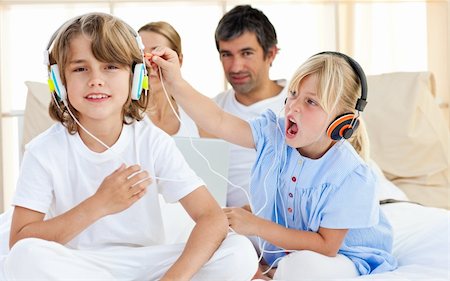 simsearch:400-04200290,k - Merry children having fun and listening music at home Stock Photo - Budget Royalty-Free & Subscription, Code: 400-04193123