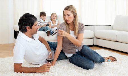 simsearch:400-04663577,k - Intimate couple talking with glasses of wine lying on the floor Stock Photo - Budget Royalty-Free & Subscription, Code: 400-04193283