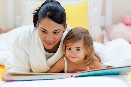 simsearch:400-05751566,k - Cute little girl reading a book with her mother in the bedroom Stock Photo - Budget Royalty-Free & Subscription, Code: 400-04193421